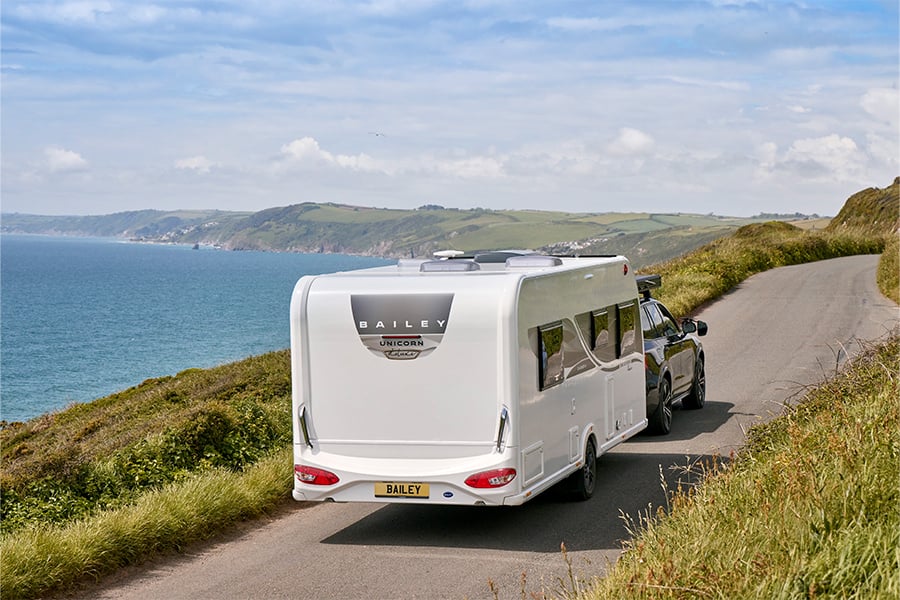 Unicorn-Deluxe-driving-coast-road